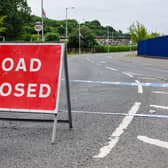 Stock image of a closed-off road following a traffic collision (Shutterstock)