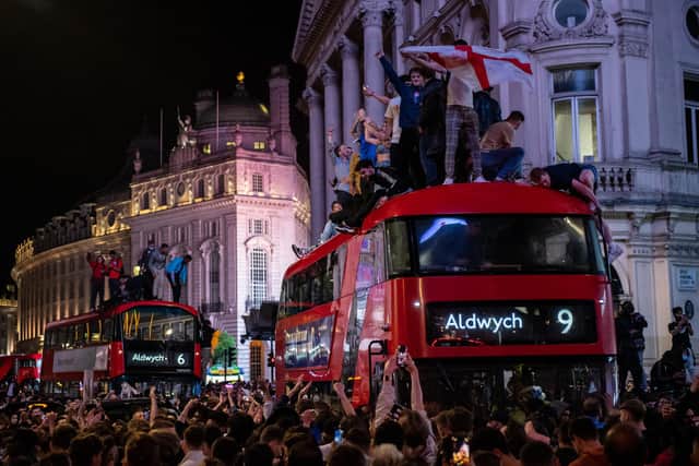 England football fans celebrate in the streets surrounding Piccadilly and Leicester Square after England beat Denmark in their semi final game on July 7 (Chris Ratcliffe/Getty)