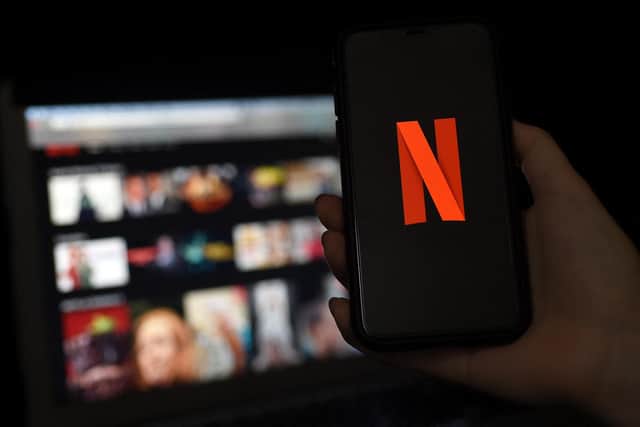Netflix are clamping down on password sharing. Is it illegal to do so? Picture: Olivier DOULIERY/AFP via Getty Images.