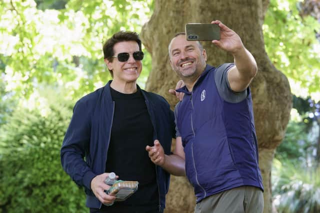 Fans take selfies with 'Tom Cruise' as he eats cocktail sausages in ...