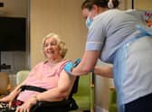 Covid infections drop 62% among care home residents five weeks after first vaccine dose, new study shows (Photo by OLI SCARFF/AFP via Getty Images)