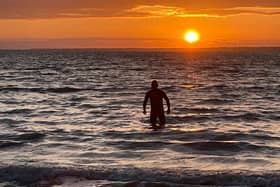 The author emerging from the waters at Totland Bay, one of the most beautiful wild swimming spots on the Isle of Wight.