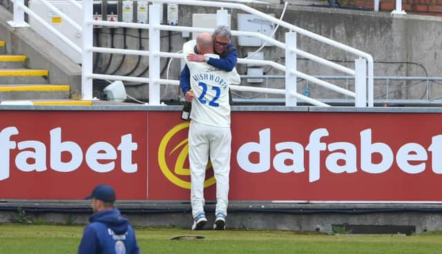 Durham bowler Chris Rushworth is congratulated by his father after the last wicket had fallen.
