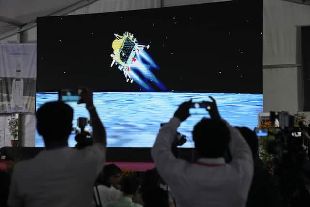 Journalists film the live telecast of spacecraft Chandrayaan-3 landing on the moon at ISRO's Telemetry, Tracking and Command Network facility in Bengaluru, India. Picture: AP Photo/Aijaz Rahi
