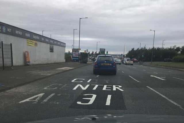Road markings north of the Queen Alexandra Bridge gave directions to the city "center" in June 2018.