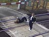 Shocking moment girl lays down in middle of railway line where trains hurtle past at 85mph