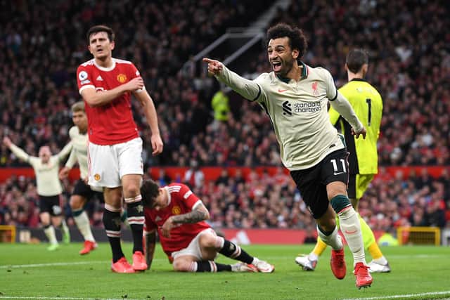 Mohamed Salah of Liverpool celebrates after scoring their side's third goal during the Premier League match between Manchester United and Liverpool at Old Trafford. (Photo by Michael Regan/Getty Images)
