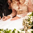 The Home Office has made new changes to the registration system - which means mothers of brides and grooms can sign the marriage certificate (Shutterstock).