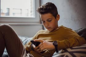 What impact are mobile phones having on our young people and should more be done to lessen their time staring at a screen? PIC: iStock/PA