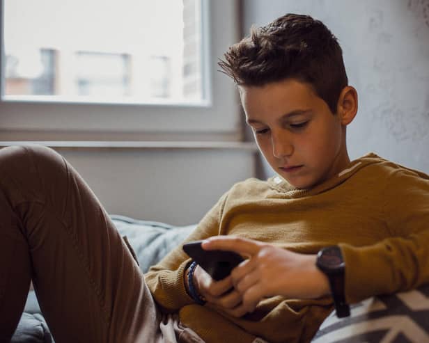 What impact are mobile phones having on our young people and should more be done to lessen their time staring at a screen? PIC: iStock/PA