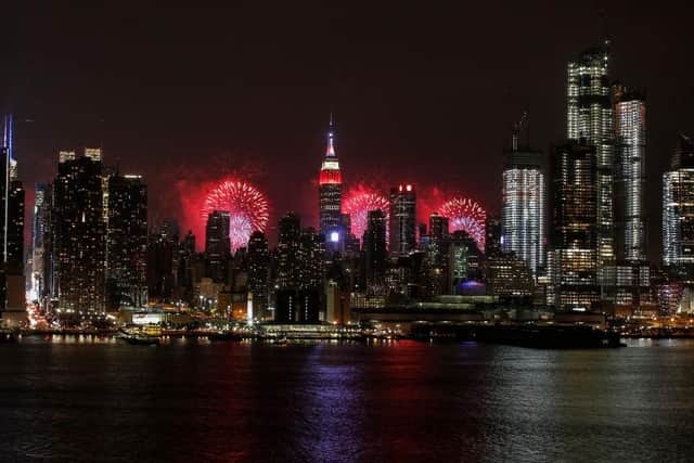 The Manhattan skyline is lit up red, white and blue, including the Empire State building (Picture: Getty Images)