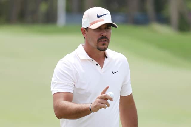 An annoyed Brooks Koepka tried to carry on with the interview but cut a frustrated figure by Bryson DeChambeau’s actions. (Pic: Getty)