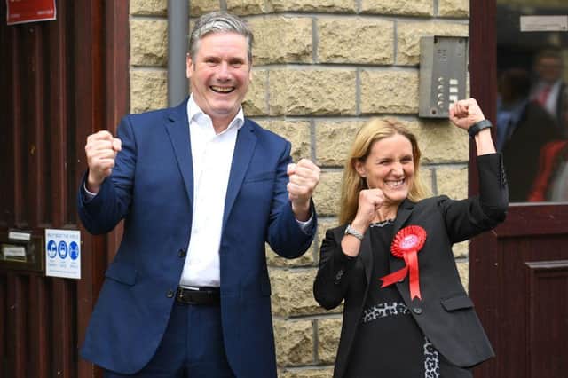 Labour Party leader Keir Starmer and Kim Leadbeater celebrate victory outside the campaign centre in Cleckheaton, West Yorkshire on July 2, 2021 (Photo by OLI SCARFF/AFP via Getty Images)