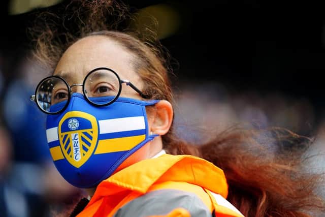 A fan is seen wearing a Leeds United face mask during the Premier League match between Leeds United and West Bromwich Albion at Elland Road at the end of last season. Fans will be subjected to spot-checks at games in the early part of the 2021-22 season.
