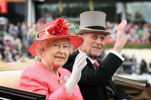 Queen Elizabeth II and Prince Philip arrive in an open carriage on Ladies Day at Royal Ascot in 2011 (Getty Images)