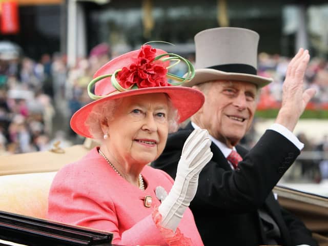 Queen Elizabeth II and Prince Philip arrive in an open carriage on Ladies Day at Royal Ascot in 2011 (Getty Images)