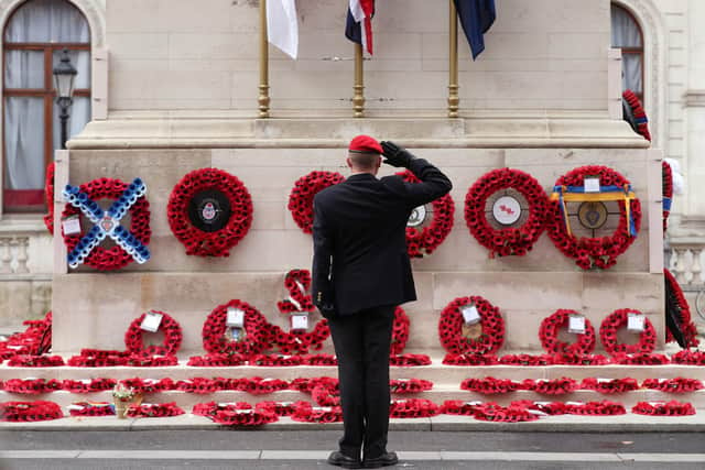 A member of the armed services gives a salute at the Cenotaph. PIC: Yui Mok/PA Wire