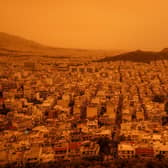 Greece’s sky turns orange.