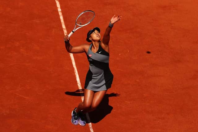 Naomi Osaka serves in her First Round match against Patricia Maria Tig of Romania during Day One of the 2021 French Open at Roland Garros (Photo: Julian Finney/Getty Images)