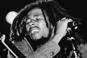 Today would have been Bob Marley's 79th birthday - so will any of his songs re-enter the UK Top 40 this week? (Credit: Getty)