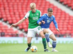 Hibs left-back Josh Doig has been linked with a move to Leeds United.