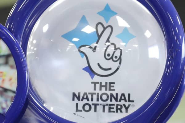 Outgoing UK National Lottery operator Camelot has revealed falling sales of tickets and instant win games as it flagged signs that players had "tightened their belts" in the face of soaring living costs.