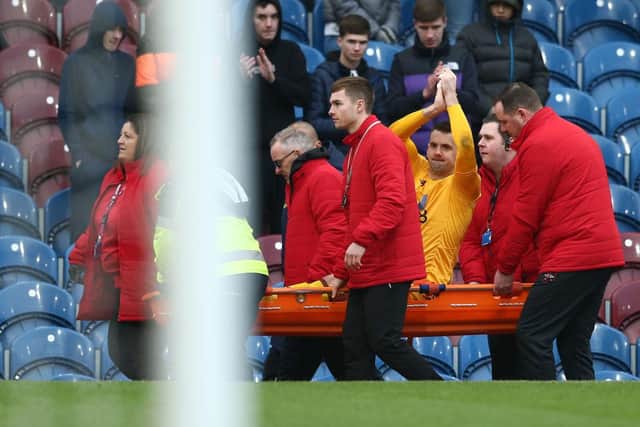 Tom Heaton leaves the pitch on a stretcher after being injured during the Premier League match against his old club Burnley on January 01, 2020.