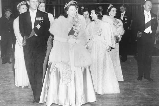 Queen Elizabeth II and Prince Philip, the Duke of Edinburgh, wearing formal dress as they attend a concert at Festival Hall, London, May 1951 (Getty Images)
