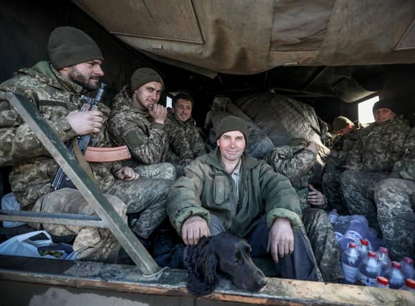 Ukrainian service personnel sit in the back of military truck in the town of Avdiivka, on the front-line with Russia-backed separatists (Picture: Aleksey Filippov/AFP via Getty Images)