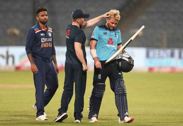 Eoin Morgan commiserates with Sam Curran after his heroics were in vain as England lost the third One Day International match against India.