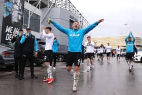 Martyn Waghorn of Derby County celebrates with fans outside the stadium as they secure safety in the Championship the Sky Bet Championship match between Derby County and Sheffield Wednesday at Pride Park Stadium.