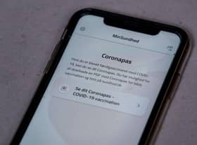 A smartphone showing Denmark's MinSundhed app and Corona passport link. The pass certifies that someone has either been fully vaccinated, has tested negative in the last 72 hours, or has tested positive two to 12 weeks earlier, conferring immunity to the virus.