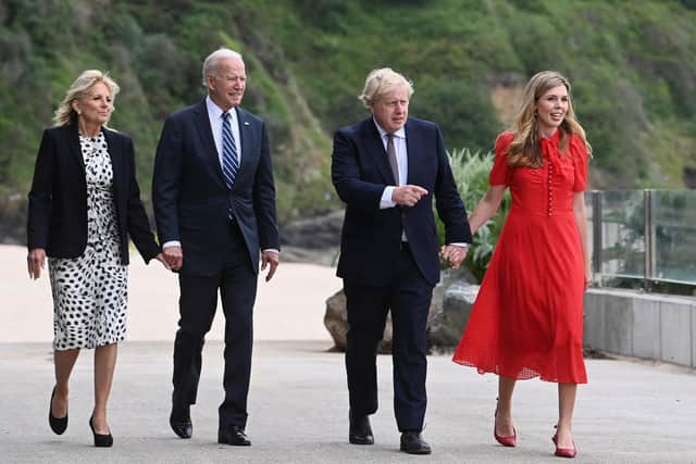 Boris Johnson and his wife Carrie Johnson walk together with U.S. President Joe Biden and First Lady Jill Biden  outside the Carbis Bay Hotel on June 10, 2021 in St Ives (WPA Pool/Getty Images)
