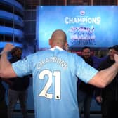 Manchester City fans celebrate outside Etihad Stadium as their team has been confirmed as Premier League champions for the third time in four seasons.