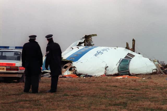 Policemen looking at the wreckage of the 747 Pan Am airliner that exploded over Lockerbie. Image: Roy Letkey/Getty Images.
