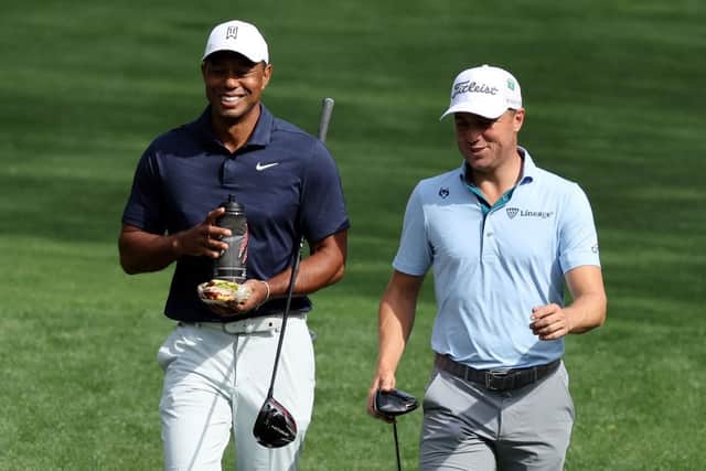 Tiger Woods and Justin Thomas share a joke during a practice round on Monday at Augusta National Golf Club. Picture: Gregory Shamus/Getty Images.