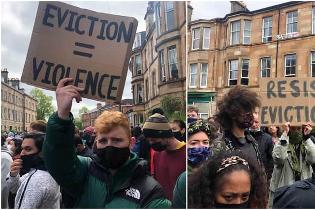 Protesters holding anti-eviction signs on Kenmure Street, Glasgow (NationalWorld)