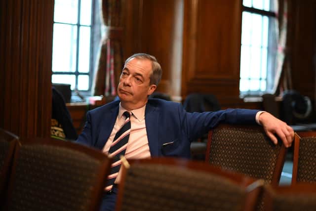 Anti-Brexit campaigner Nigel Farage, and former leader of the Reform UK political party, listens to a speaker duing a press conference in central London on March 20, 2023. (Photo by Daniel LEAL / AFP)