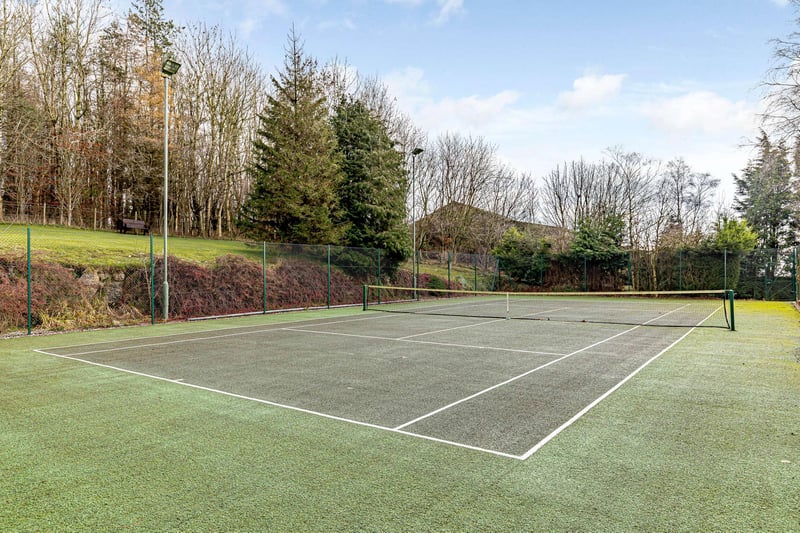 The property has an all weather outdoor tennis court