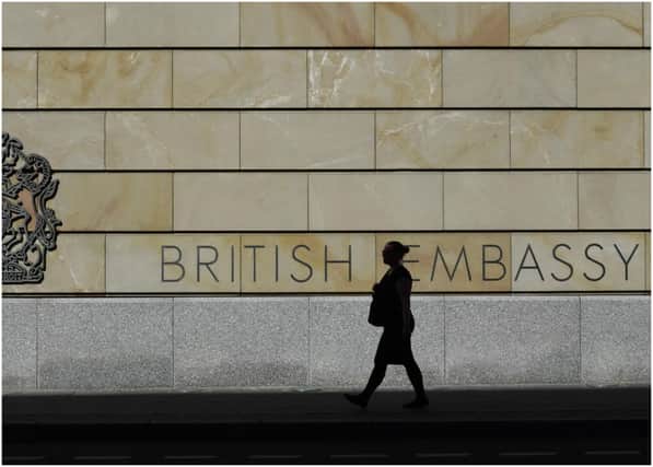 A 57-year-old British embassy employee - identified as David S - was detained on Tuesday  (Photo credit should read JOHN MACDOUGALL/AFP via Getty Images)