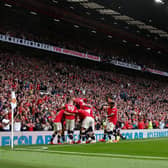 Manchester United celebrate in front of their fans. (Photo by Catherine Ivill/Getty Images,)
