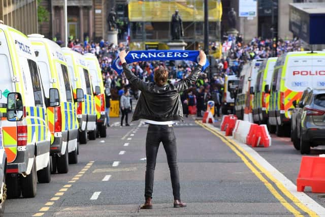 Rangers fans celebrate in George Square in Glasgow on May 15, 2021, after Rangers lift the Scottish Premiership trophy for the first time in 10 years.