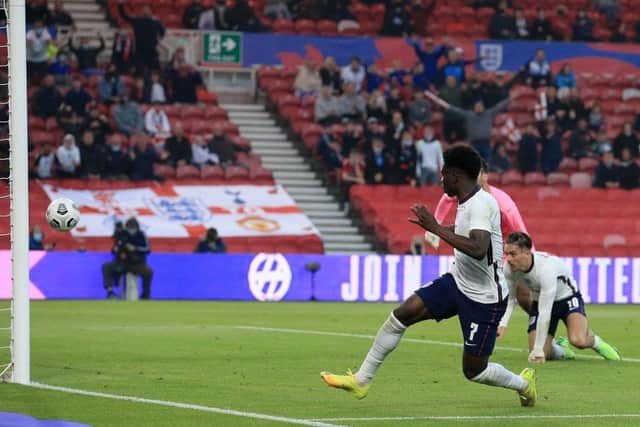 England's Bukayo Saka scores the winning goal during the international friendly football match between England and Austria. He then had to field questions on the booing from fans.