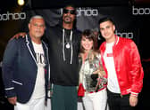 Mahmud Kamani (left) with Snoop Dogg, co-founder Carol Kane and son Samir Kamani (Getty Images)