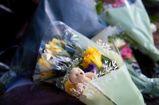Soft toys and flowers are left at the scene on High Street, Brownhills, near Walsall in the West Midlands, where a two-week-old baby boy in a pram was hit by a BMW car at around 4pm on Easter Sunday (Photo: PA/Jacob King)