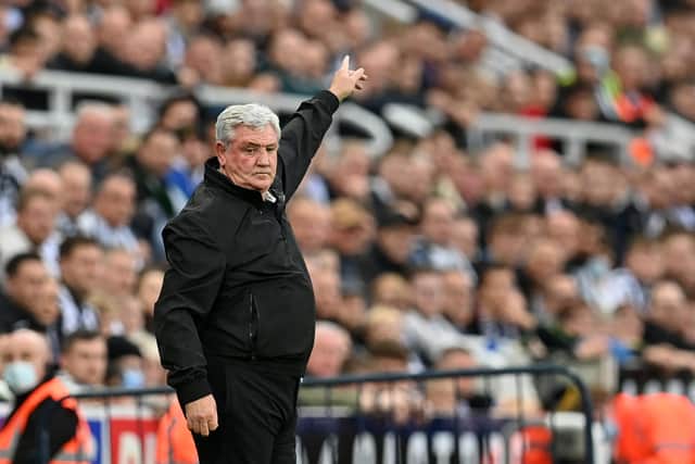 Newcastle United's English head coach Steve Bruce gestures on the touchline during the English Premier League football match between Newcastle United and Tottenham Hotspur at St James' Park in Newcastle-upon-Tyne, north east England on October 17, 2021. - RESTRICTED TO EDITORIAL USE. No use with unauthorized audio, video, data, fixture lists, club/league logos or 'live' services. Online in-match use limited to 120 images. An additional 40 images may be used in extra time. No video emulation. Social media in-match use limited to 120 images. An additional 40 images may be used in extra time. No use in betting publications, games or single club/league/player publications. (Photo by Paul ELLIS / AFP) / RESTRICTED TO EDITORIAL USE. No use with unauthorized audio, video, data, fixture lists, club/league logos or 'live' services. Online in-match use limited to 120 images. An additional 40 images may be used in extra time. No video emulation. Social media in-match use limited to 120 images. An additional 40 images may be used in extra time. No use in betting publications, games or single club/league/player publications. / RESTRICTED TO EDITORIAL USE. No use with unauthorized audio, video, data, fixture lists, club/league logos or 'live' services. Online in-match use limited to 120 images. An additional 40 images may be used in extra time. No video emulation. Social media in-match use limited to 120 images. An additional 40 images may be used in extra time. No use in betting publications, games or single club/league/player publications. (Photo by PAUL ELLIS/AFP via Getty Images)