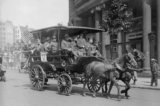 On Fourth of July 1918, American soldiers drove through streets waving the stars and strips to celebrate (Picture: Getty Images)