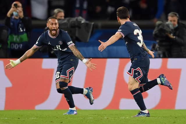 PARIS, FRANCE - SEPTEMBER 28: Lionel Messi of Paris Saint-Germain celebrates with team mate Neymar after scoring their sides second goal during the UEFA Champions League group A match between Paris Saint-Germain and Manchester City at Parc des Princes on September 28, 2021 in Paris, France. (Photo by Matthias Hangst/Getty Images)