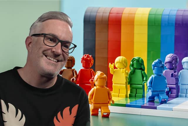 Designer and vice president of design for Lego, Matthew Ashton, with the company's new rainbow-themed 'Everyone is Awesome' set (Photo: LEGO/PA Media)