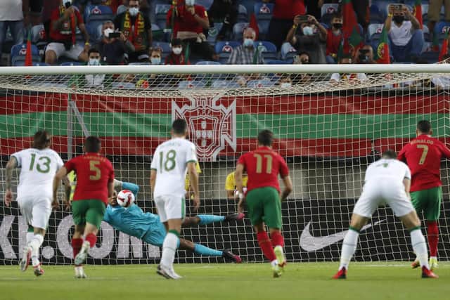 Gavin Bazunu saved a first-half penalty from Cristiano Ronaldo in tonight's World Cup qualification match. Picture: AP Photo/Armando Franca